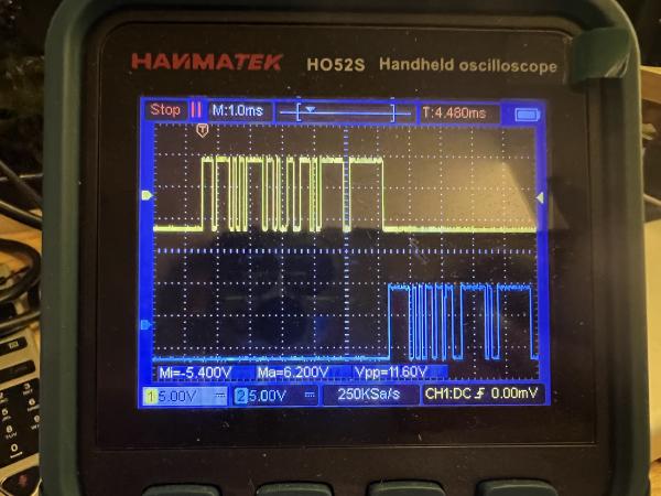 Hanmatek HO52S oscilloscope screen photo, displaying two signals, both showing transmitted data in square form, from -5.4V to 6.2V The Oscilloscope™: better at captures than a Poke-ball